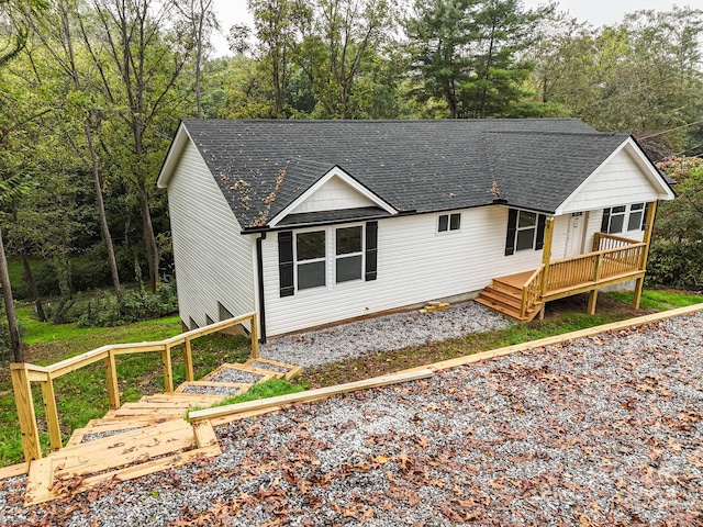 view of front of property with a wooden deck