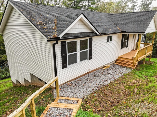 view of property exterior featuring a deck