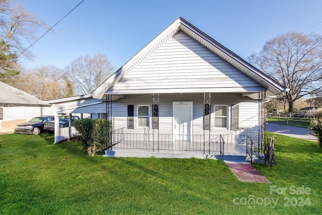 view of front of home with a front lawn and a porch