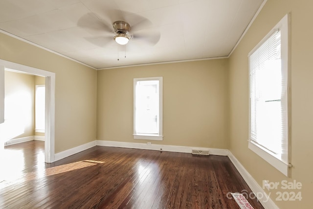 unfurnished room featuring hardwood / wood-style flooring, a wealth of natural light, ornamental molding, and ceiling fan