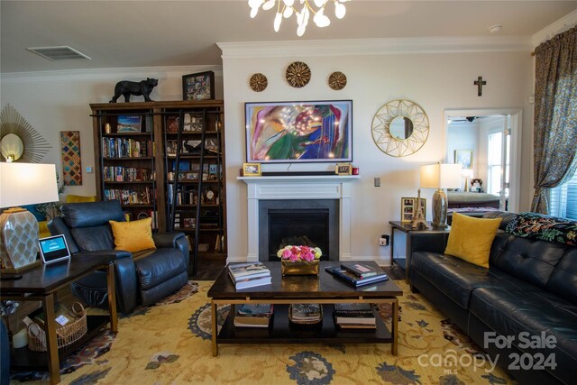 living room featuring ornamental molding and wood-type flooring