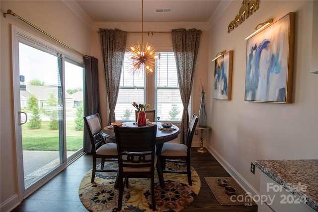 dining area featuring a notable chandelier, dark wood-type flooring, and crown molding