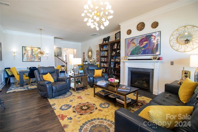 living room featuring hardwood / wood-style flooring, a notable chandelier, and ornamental molding