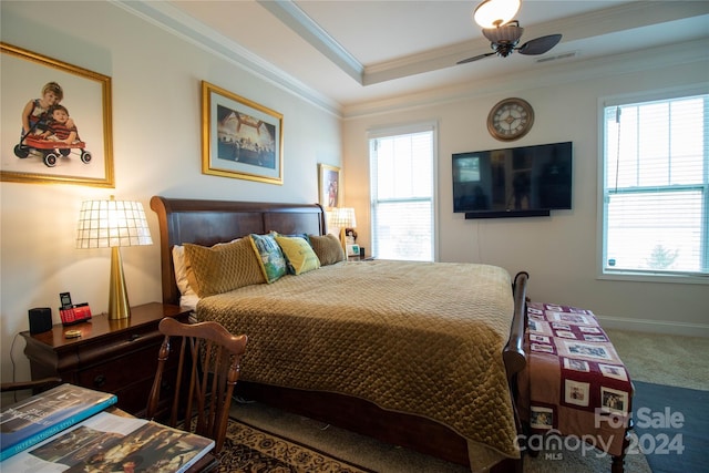 bedroom featuring carpet, crown molding, and multiple windows