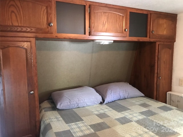 bedroom with radiator heating unit