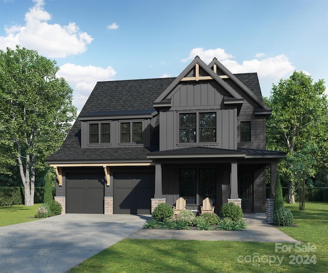 view of front of house featuring a porch, a garage, and a front yard