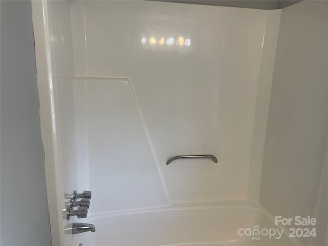 bathroom featuring washtub / shower combination