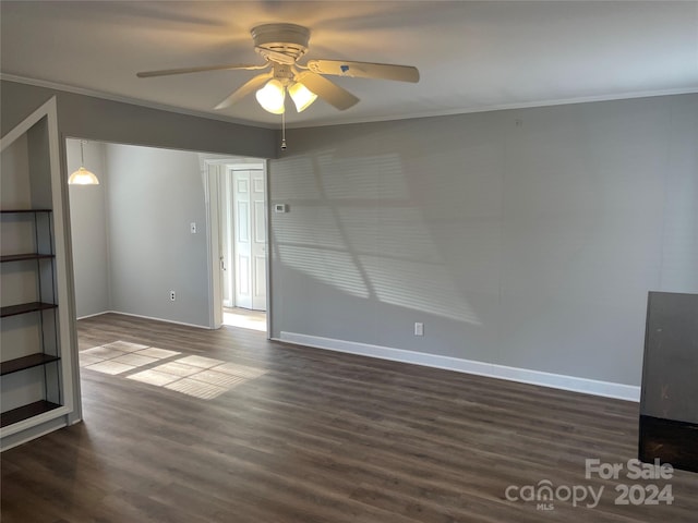 unfurnished living room with ceiling fan, dark hardwood / wood-style flooring, and ornamental molding