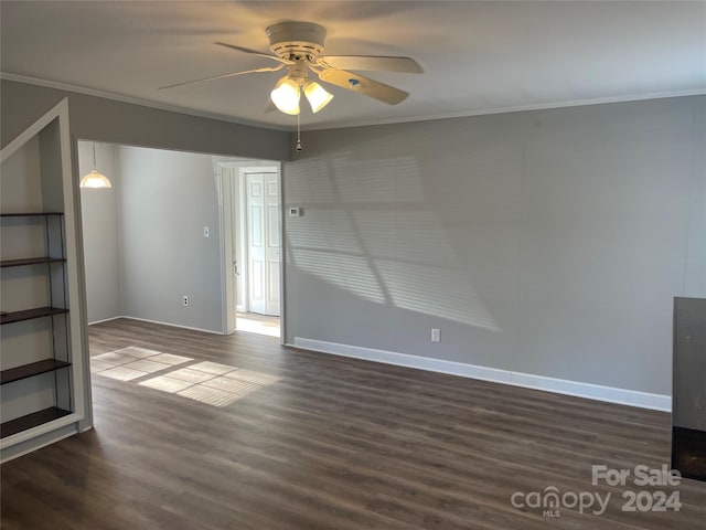 unfurnished living room with ceiling fan, dark wood-type flooring, and ornamental molding