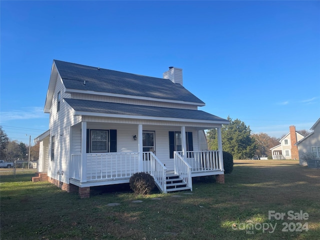 bungalow featuring a porch and a front yard