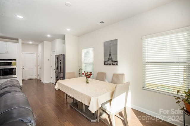 dining area featuring dark hardwood / wood-style floors