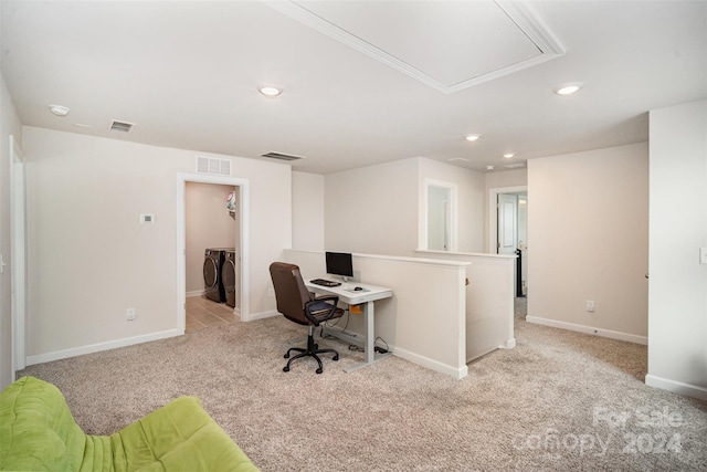 carpeted home office featuring separate washer and dryer