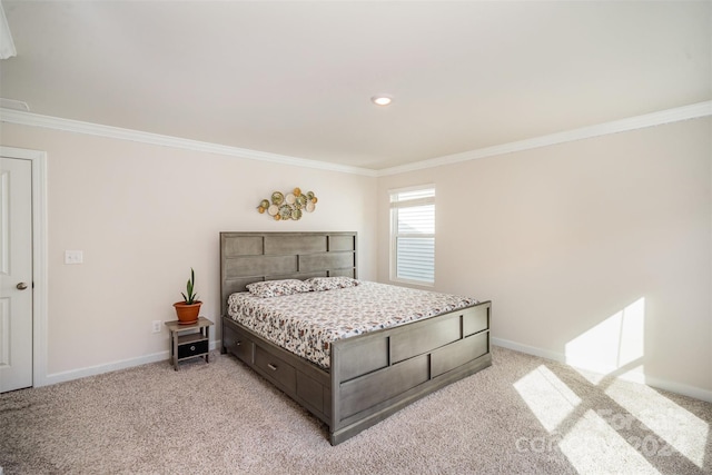 carpeted bedroom featuring crown molding