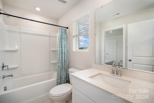 full bathroom featuring toilet, vanity, and shower / tub combo