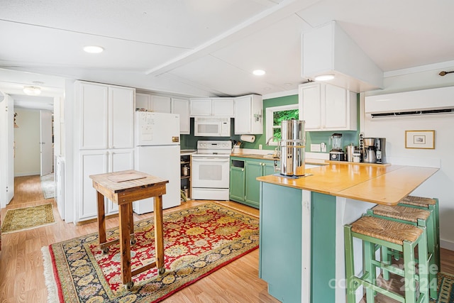 kitchen with white appliances, vaulted ceiling with beams, a wall mounted air conditioner, and light hardwood / wood-style flooring