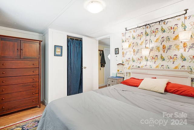 bedroom with light wood-type flooring