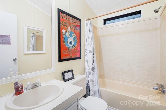 full bathroom with a textured ceiling, vanity, shower / tub combo with curtain, and toilet