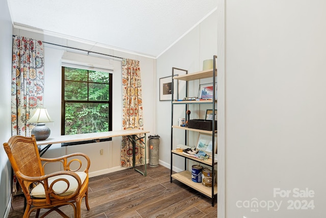 sitting room featuring ornamental molding and dark hardwood / wood-style flooring