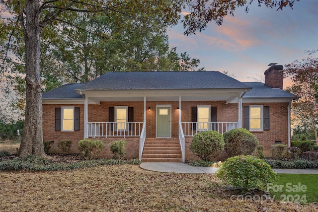 single story home featuring a porch