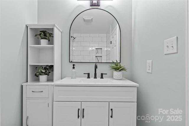 bathroom with vanity and walk in shower