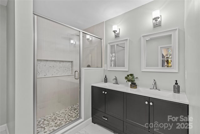 bathroom featuring vanity and an enclosed shower