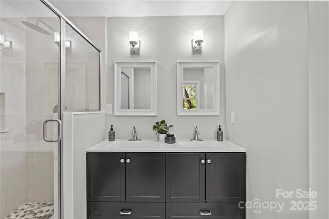 bathroom featuring walk in shower and vanity