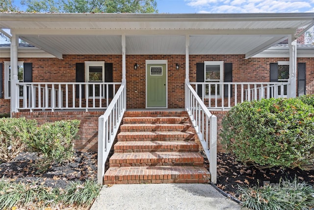 entrance to property with a porch