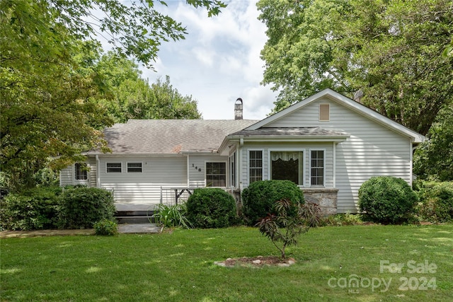 view of front of home with a front yard