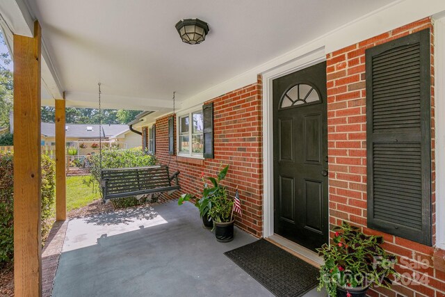 entrance to property with covered porch