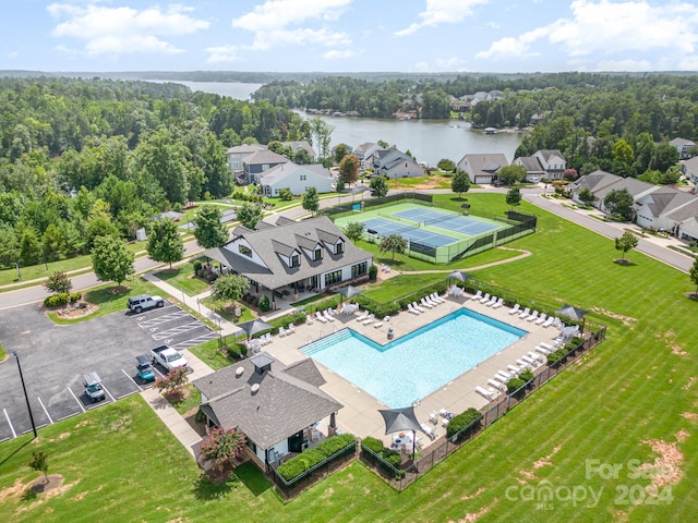 bird's eye view featuring a water view and a forest view