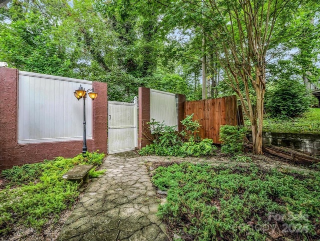 view of yard featuring a gate and fence