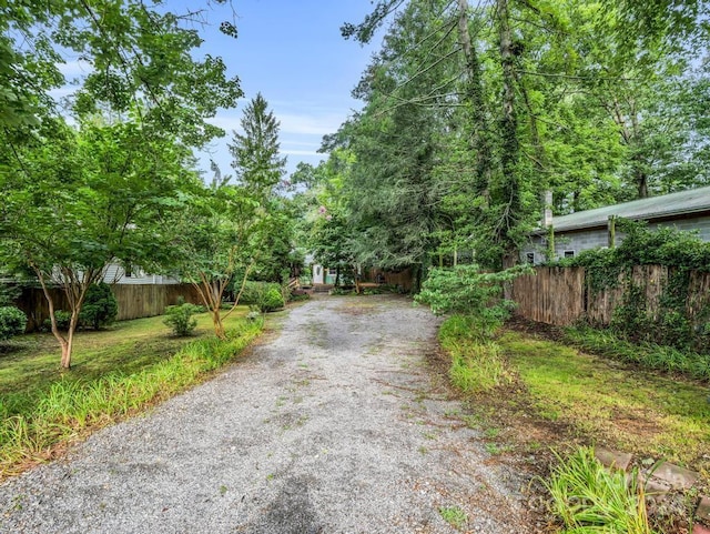 view of road with gravel driveway