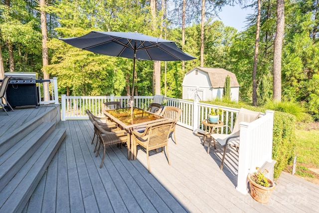 wooden deck featuring a shed