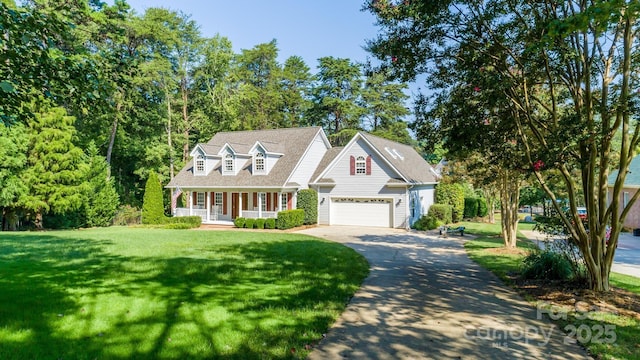 cape cod home featuring a garage, a front yard, a porch, and driveway