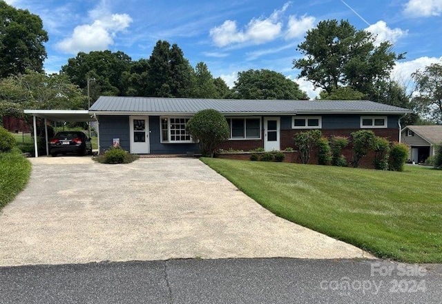 ranch-style home with a carport and a front lawn