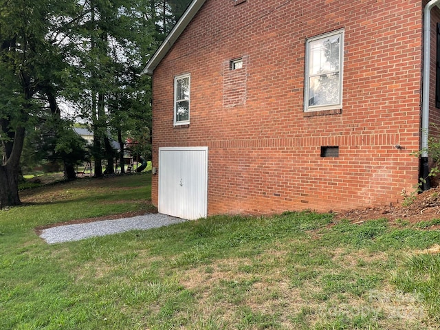 view of side of property with a yard