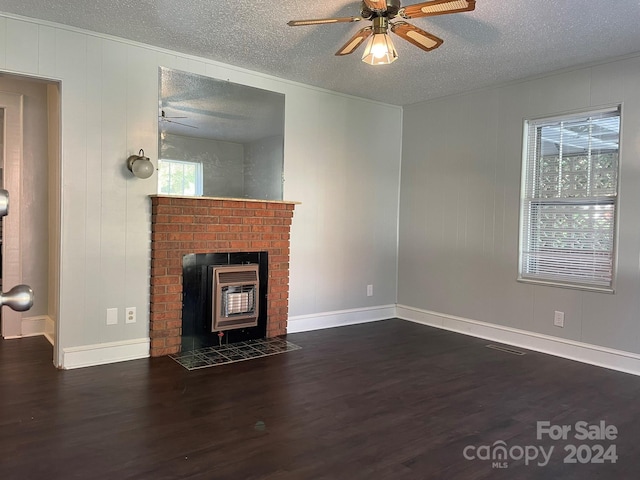 unfurnished living room featuring ceiling fan, plenty of natural light, and dark hardwood / wood-style floors