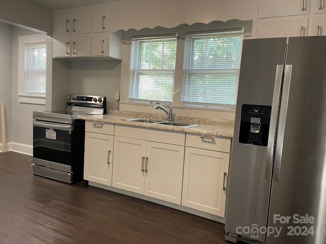 kitchen with dark wood-type flooring, sink, white cabinetry, and appliances with stainless steel finishes