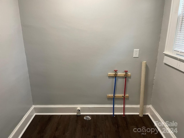 washroom featuring dark hardwood / wood-style floors and hookup for a washing machine