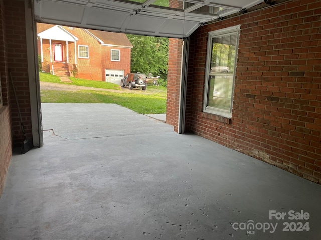 view of patio / terrace featuring a garage