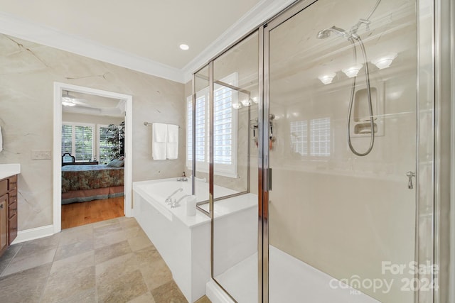 bathroom with plus walk in shower, vanity, and crown molding