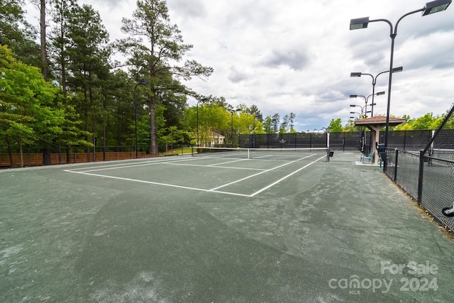 view of tennis court with fence