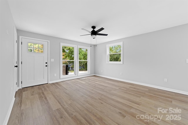 interior space featuring ceiling fan and light hardwood / wood-style floors