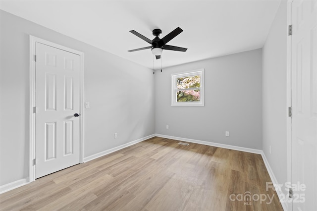 unfurnished bedroom with light hardwood / wood-style floors and ceiling fan