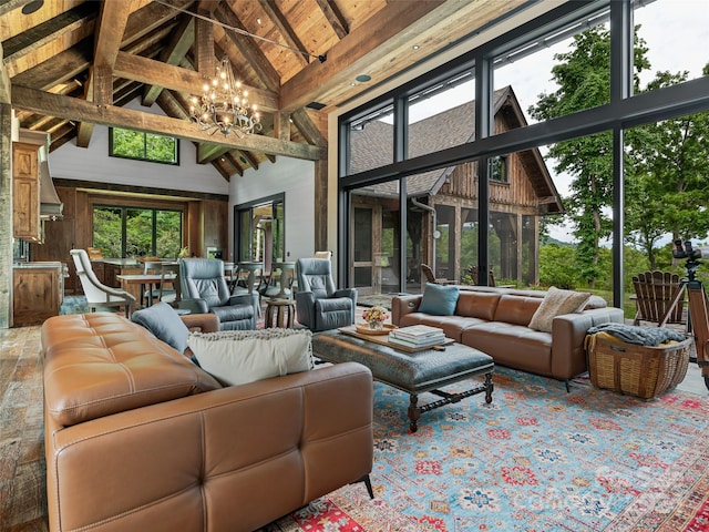 interior space featuring beamed ceiling, high vaulted ceiling, a chandelier, and wood walls