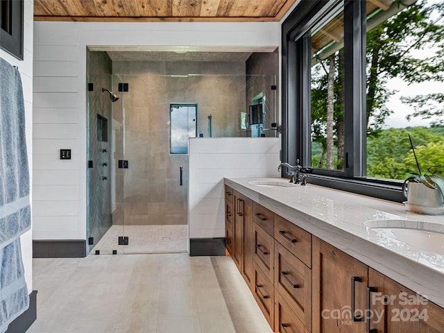 bathroom featuring vanity, wooden ceiling, an enclosed shower, and wooden walls