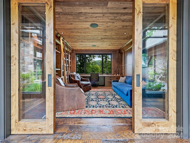 unfurnished sunroom featuring wood ceiling