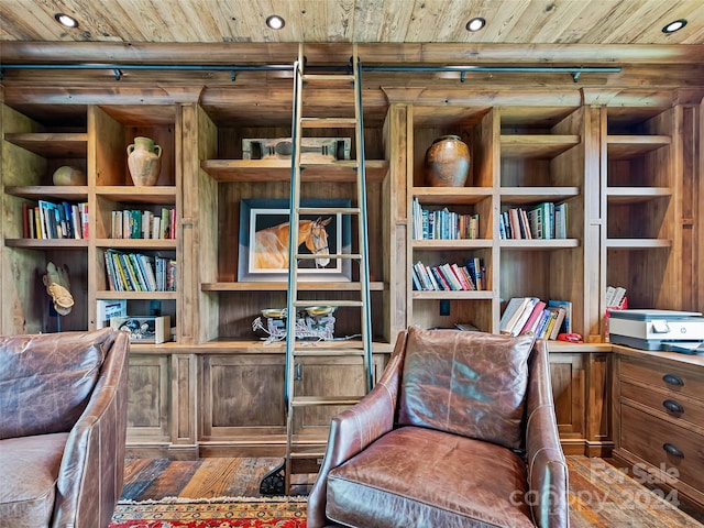 living area with dark hardwood / wood-style floors and wood ceiling