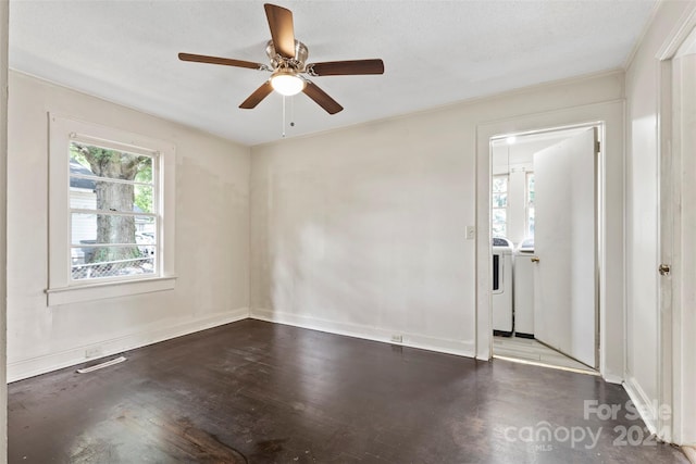 unfurnished room featuring washer and clothes dryer, a textured ceiling, and ceiling fan