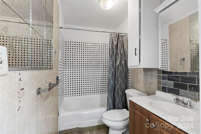 full bathroom with shower / bath combination with curtain, toilet, vanity, tile walls, and decorative backsplash